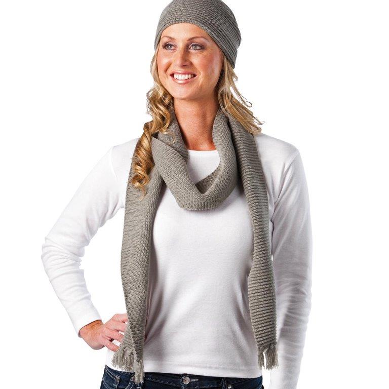 A woman wearing a gray beanie and scarf